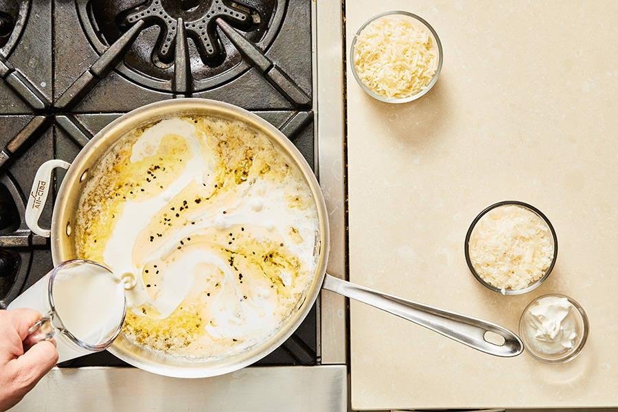 Creamy garlic Parmesan Alfredo sauce in a skillet